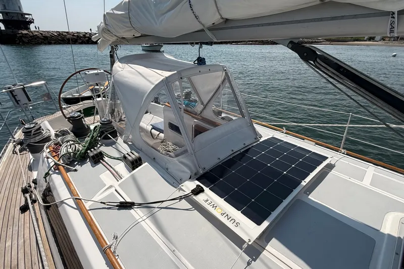 Slide: The Image of 1988 Belliure 41 sailboat with solar panel and cockpit cover on deck. - 59