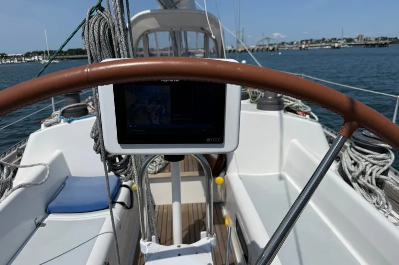 Slide: The Image of Cockpit view of 1988 Belliure 41 sailboat with navigation equipment and ropes. - 75