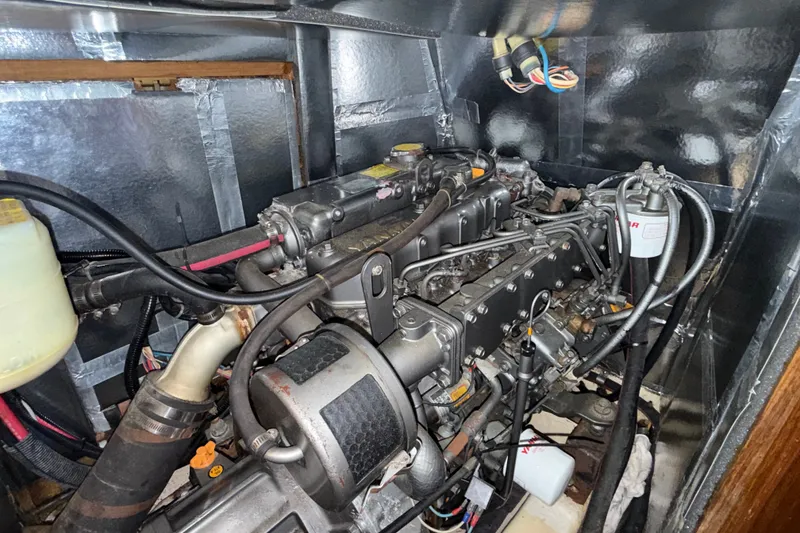 Slide: The Image of Engine compartment of a 1988 Belliure 41 yacht, showcasing detailed mechanical components. - 83