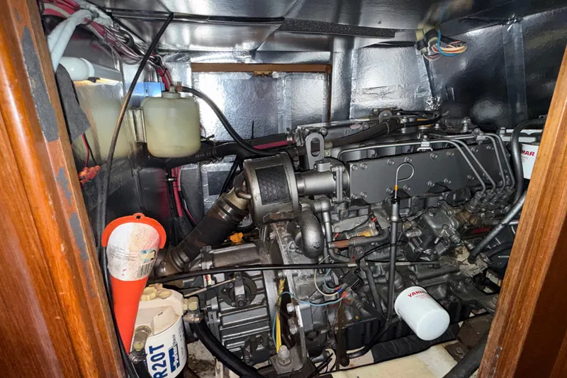 Slide: The Image of Engine room of a 1988 Belliure 41 yacht, showcasing mechanical components. - 82