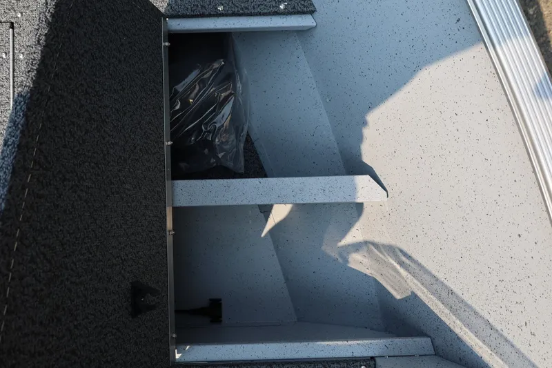 Slide: The Image of Interior view of a 2027 Lund 1600 Fury SS featuring storage compartments. - 11