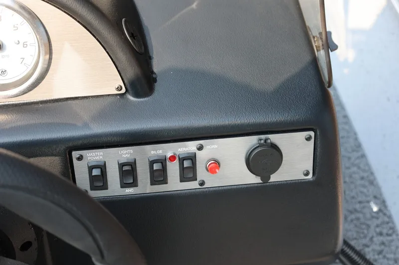 Slide: The Image of Boat dashboard with switches for power, lights, bilge, aerator, and horn. - 16