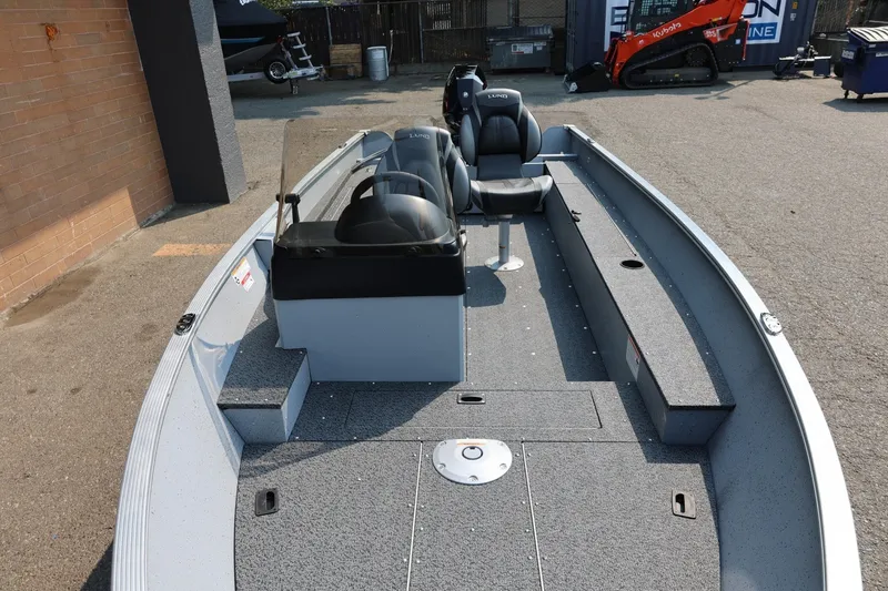 Slide: The Image of Lund 1600 Fury SS 2027: An open boat with a gray interior, two seats, and a helm console. - 22
