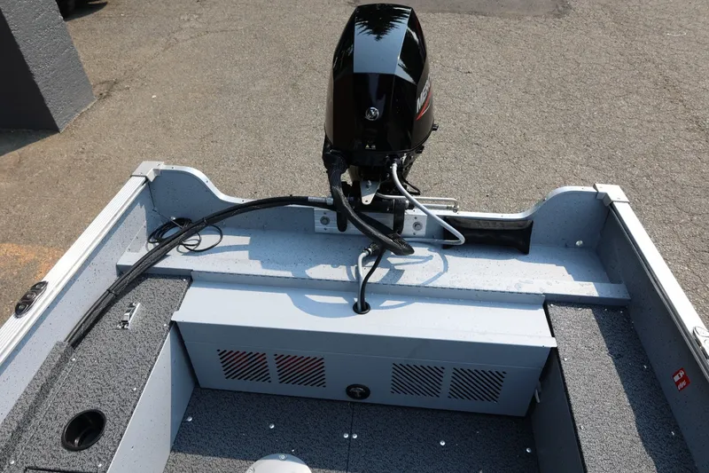 Slide: The Image of The image shows the stern of a Lund 1600 Fury SS boat with an outboard motor. - 20