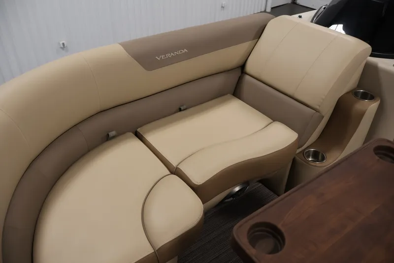 Slide: The Image of Luxurious seating on 2022 Veranda VR22RC boat with beige upholstery and cup holders. - 14