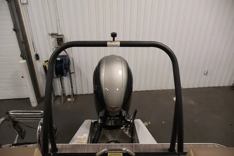Slide: The Image of 2022 Veranda VR22RC boat with a powerful outboard motor in a garage setting. - 39