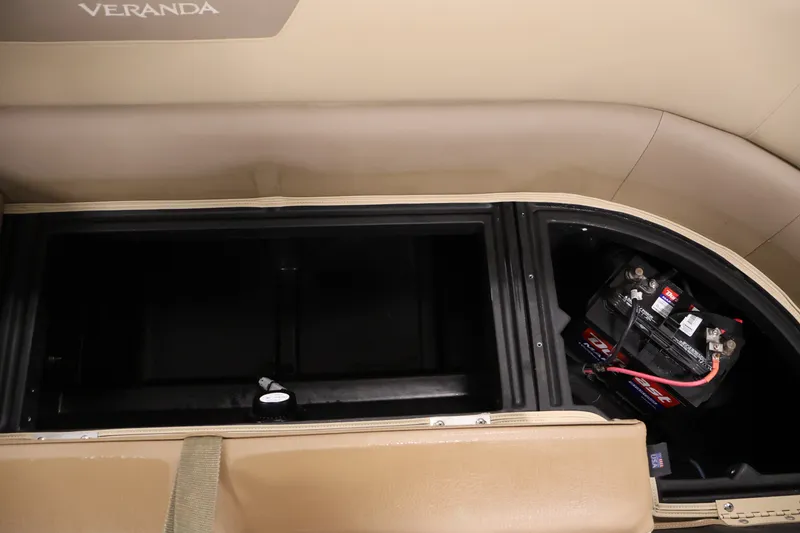 Slide: The Image of 2022 Veranda VR22RC boat storage compartment with battery setup. - 38