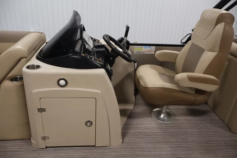Slide: The Image of 2022 Veranda VR22RC boat interior with steering console and captain's chair. - 19