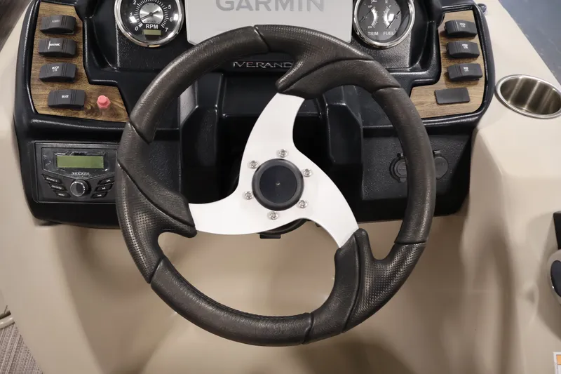 Slide: The Image of Steering wheel and dashboard of 2022 Veranda VR22RC boat with Garmin display. - 22