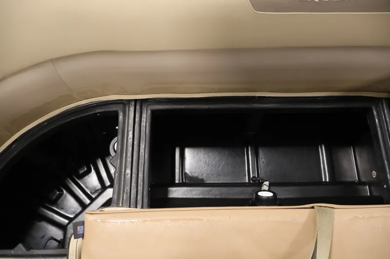 Slide: The Image of Interior storage compartment of 2022 Veranda VR22RC pontoon boat, featuring spacious black storage area. - 36