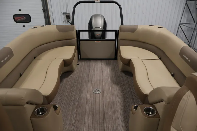 Slide: The Image of 2022 Veranda VR22RC pontoon boat interior with beige seating and cup holders. - 34