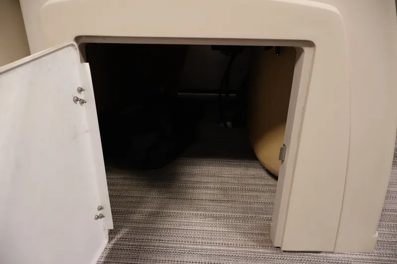 Slide: The Image of Open storage compartment in 2022 Veranda VR22RC boat, featuring carpeted flooring. - 20