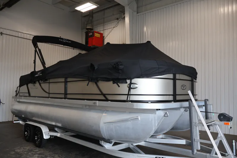 Slide: The Image of 2022 Veranda VR22RC pontoon boat with cover on trailer in indoor storage. - 49