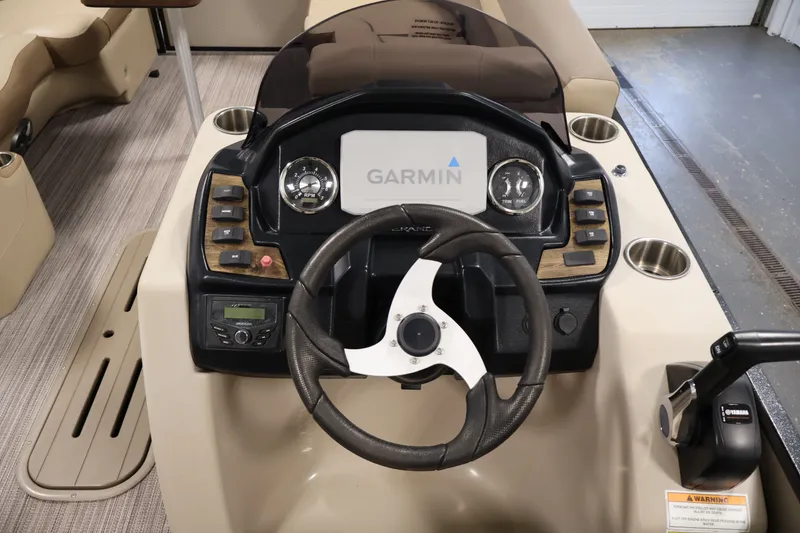 Slide: The Image of Cockpit of 2022 Veranda VR22RC boat with Garmin navigation system and steering wheel. - 21