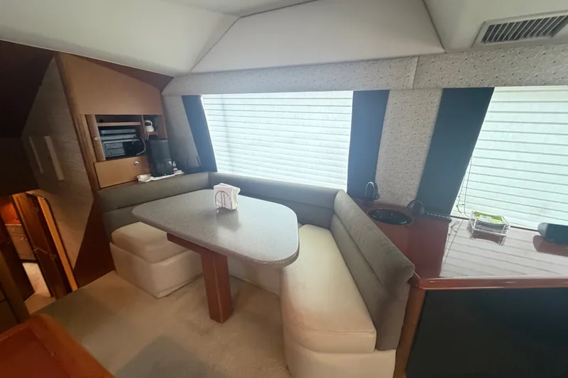 Slide: The Image of Interior of 2001 Ocean Yachts 56 Super Sport with cozy dining area and modern amenities. - 23