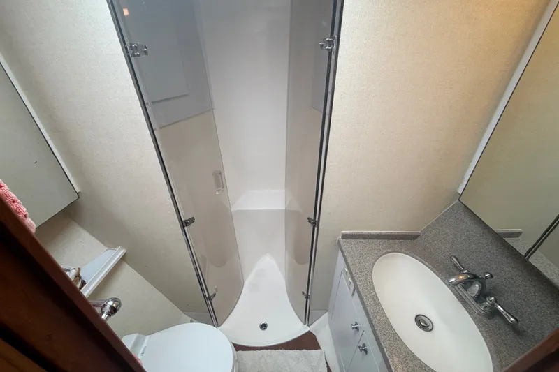 Slide: The Image of Bathroom interior of 2001 Ocean Yachts 56 Super Sport with shower and sink. - 30