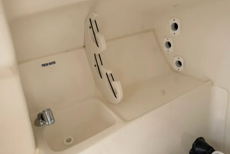 Slide: The Image of Interior of 2027 Key West 239 DFS boat with fresh water sink and storage. - 41