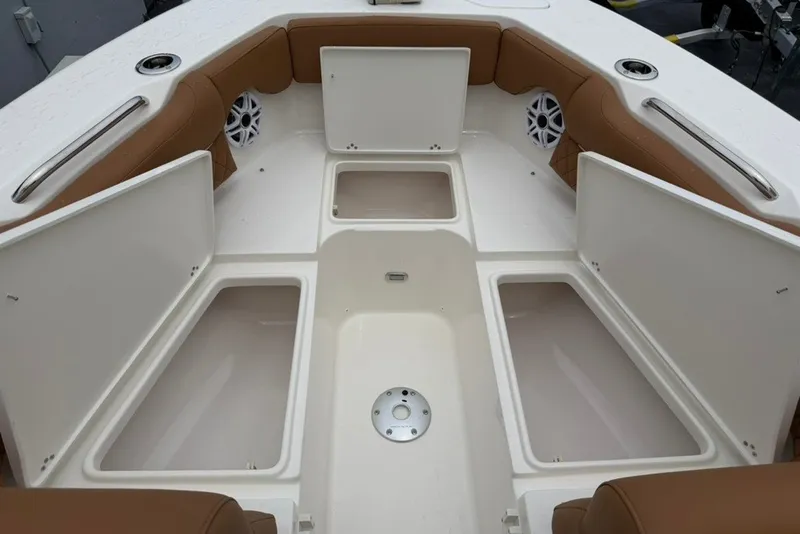 Slide: The Image of Interior view of 2027 Key West 239 DFS boat with open storage compartments. - 28