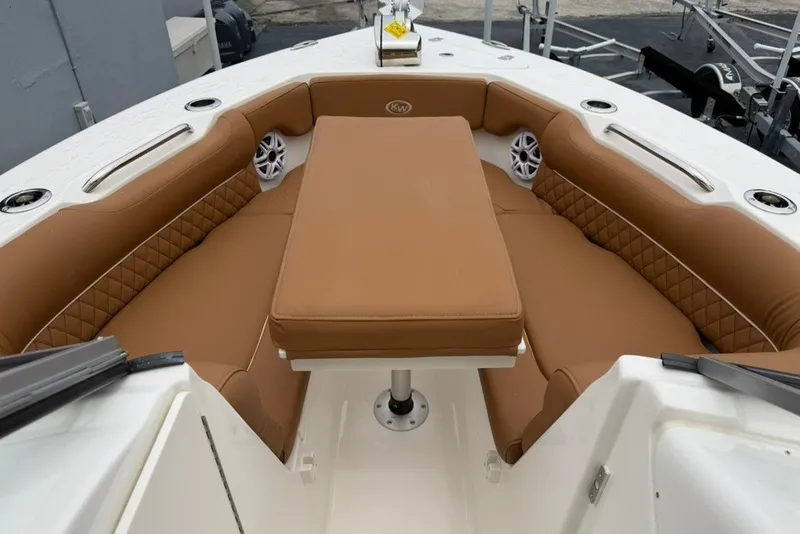 Slide: The Image of Luxurious seating area on 2027 Key West 239 DFS boat with brown cushions. - 25