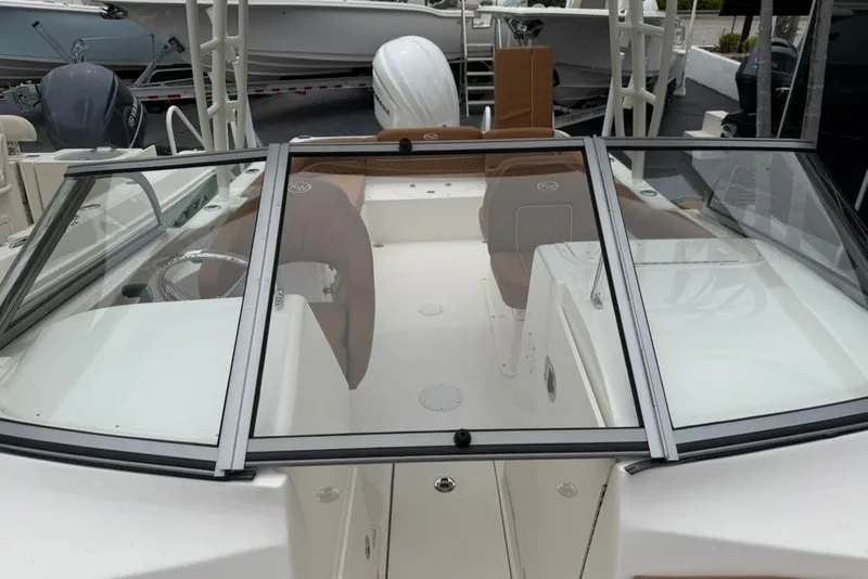 Slide: The Image of 2027 Key West 239 DFS boat interior with dual consoles and windshield. - 9
