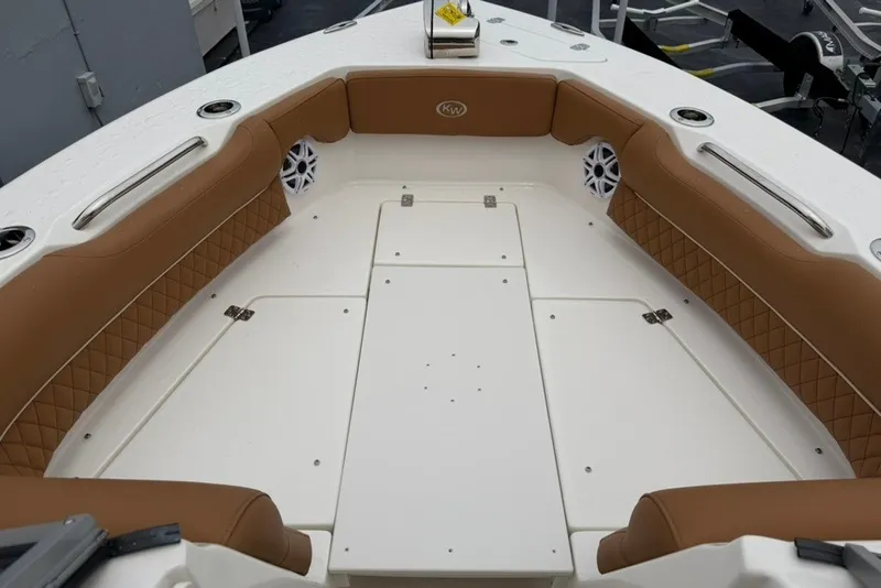Slide: The Image of 2027 Key West 239 DFS boat interior with tan seating and white deck. - 26
