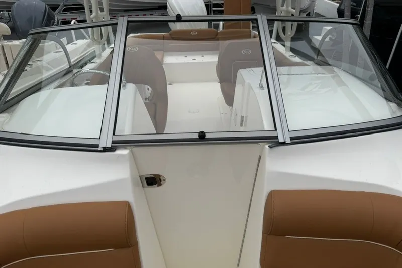Slide: The Image of 2027 Key West 239 DFS boat interior with tan seating and windshield. - 10