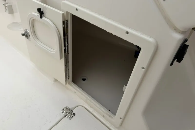 Slide: The Image of Open storage compartment on a 2027 Key West 239 DFS boat, showcasing interior space. - 38