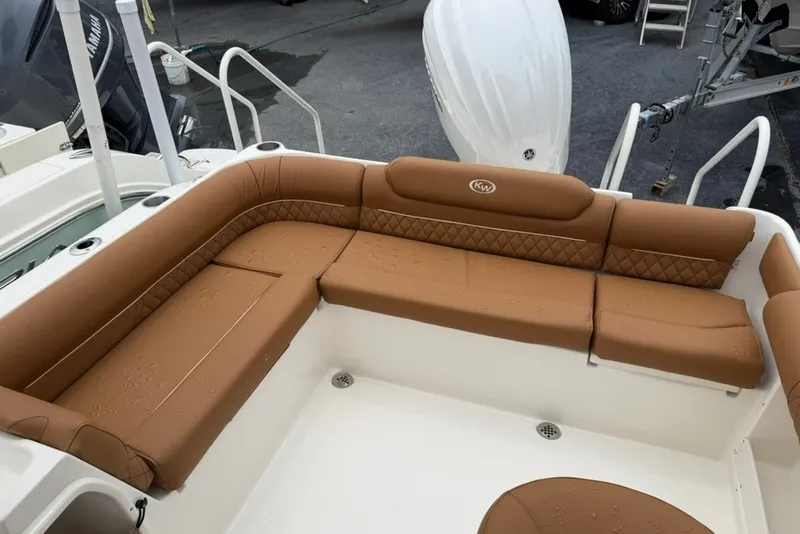 Slide: The Image of Luxurious seating on 2027 Key West 239 DFS boat, featuring tan upholstery and diamond stitching. - 15