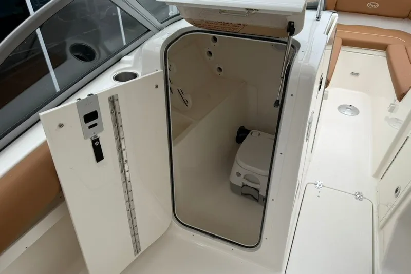 Slide: The Image of Interior view of 2027 Key West 239 DFS boat with open storage compartment. - 40