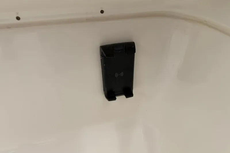 Slide: The Image of Black phone holder mounted on a white surface inside a 2027 Key West 239 DFS boat. - 32