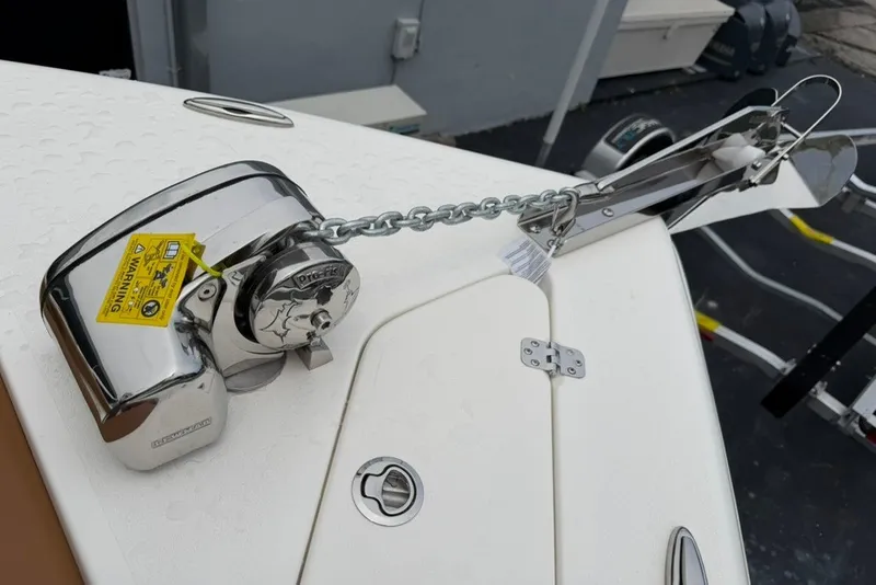 Slide: The Image of 2027 Key West 239 DFS boat anchor system with chain and winch on deck. - 45