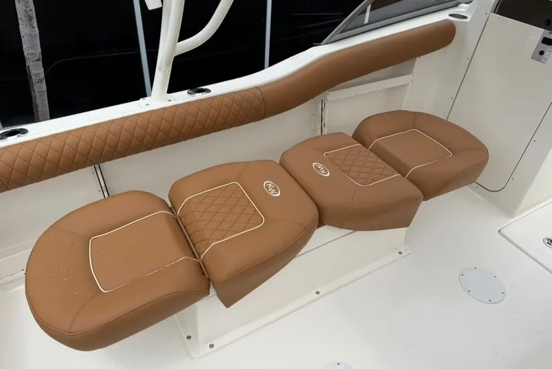 Slide: The Image of 2027 Key West 239 DFS boat with tan leather seating and diamond stitching. - 20