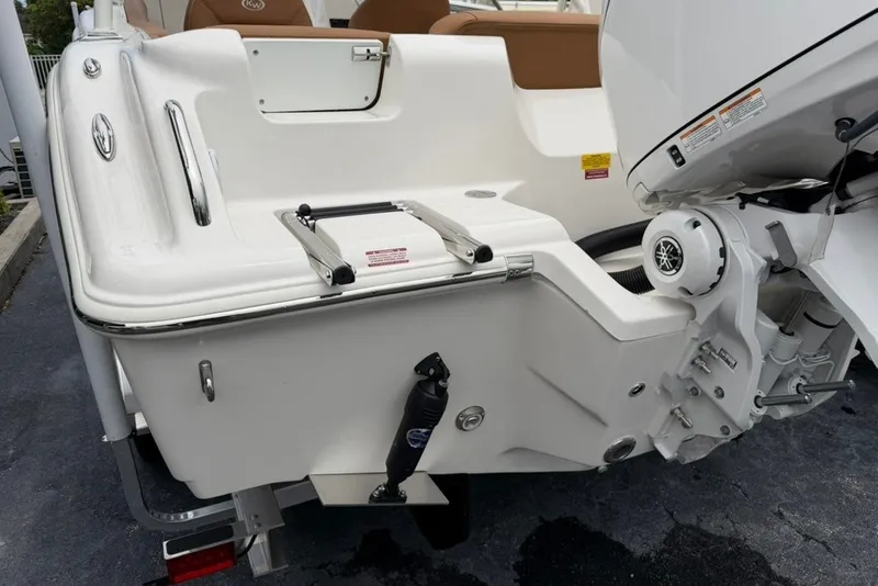 Slide: The Image of 2027 Key West 239 DFS boat stern with motor and swim ladder. - 48