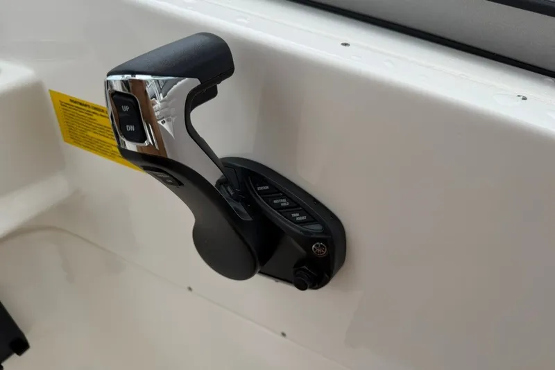 Slide: The Image of Throttle control lever on 2027 Key West 239 DFS boat dashboard. - 31