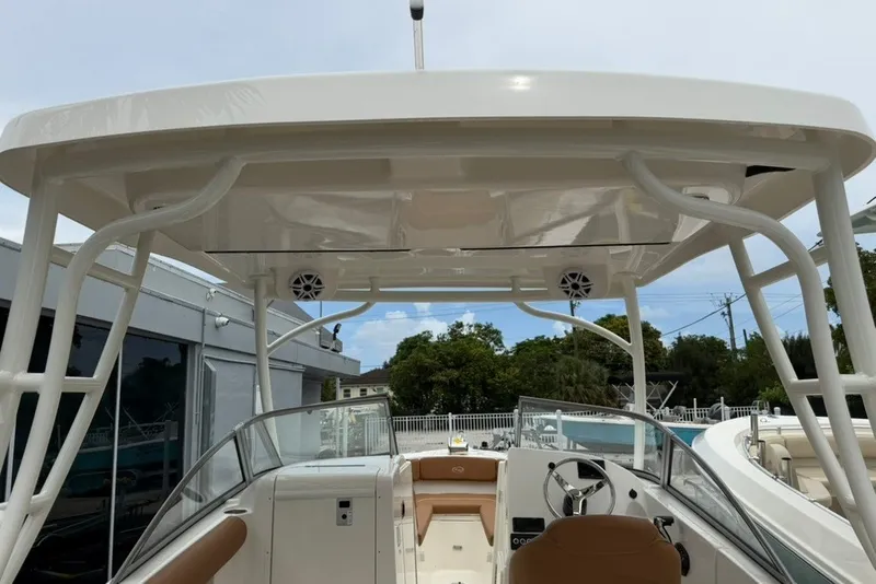 Slide: The Image of 2027 Key West 239 DFS boat interior with helm, seating, and overhead speakers. - 12