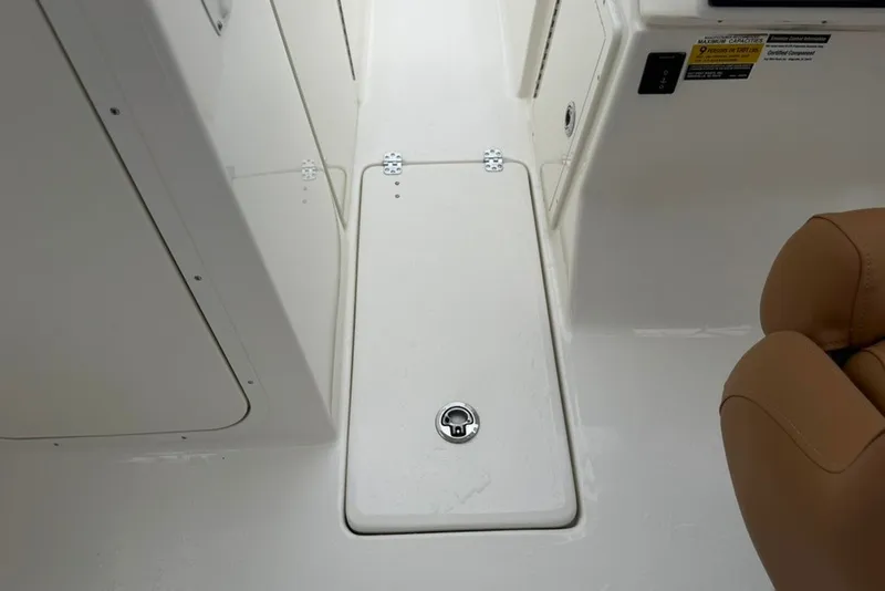 Slide: The Image of Interior view of 2027 Key West 239 DFS boat, featuring storage compartment and seating. - 36