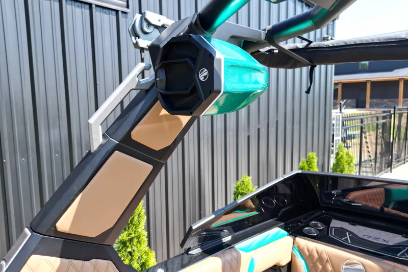 Slide: The Image of 2027 Tigé 22RZX boat with sleek design and modern audio system. - 10