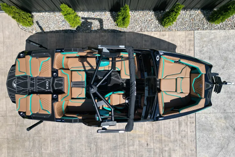 Slide: The Image of Overhead view of 2027 Tigé 22RZX boat with tan and teal seating. - 5