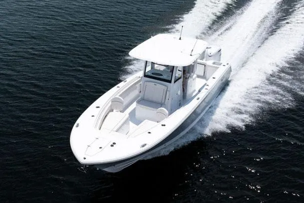 Slide: The Image of Manufacturer Provided Image: 2025 Sea Hunt Gamefish 30 Forward Seating boat cruising on open water. - 2