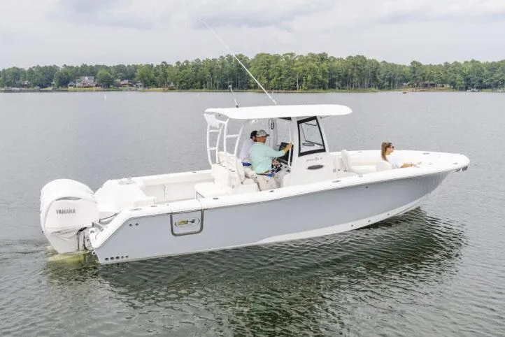 Slide: The Image of Manufacturer Provided Image: 2025 Sea Hunt Gamefish 30 Forward Seating boat cruising on a calm lake. - 5