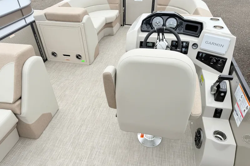 Slide: The Image of Interior of 2027 Manitou Aurora SE 21 boat with steering console and seating. - 13