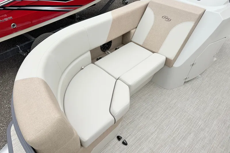 Slide: The Image of Luxurious seating on 2027 Manitou Aurora SE 21 pontoon boat, featuring beige and white upholstery. - 5