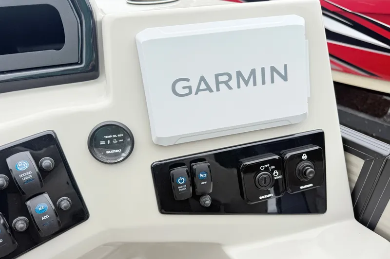 Slide: The Image of Control panel of 2027 Manitou Aurora SE 21 with Garmin navigation system and Suzuki gauges. - 11