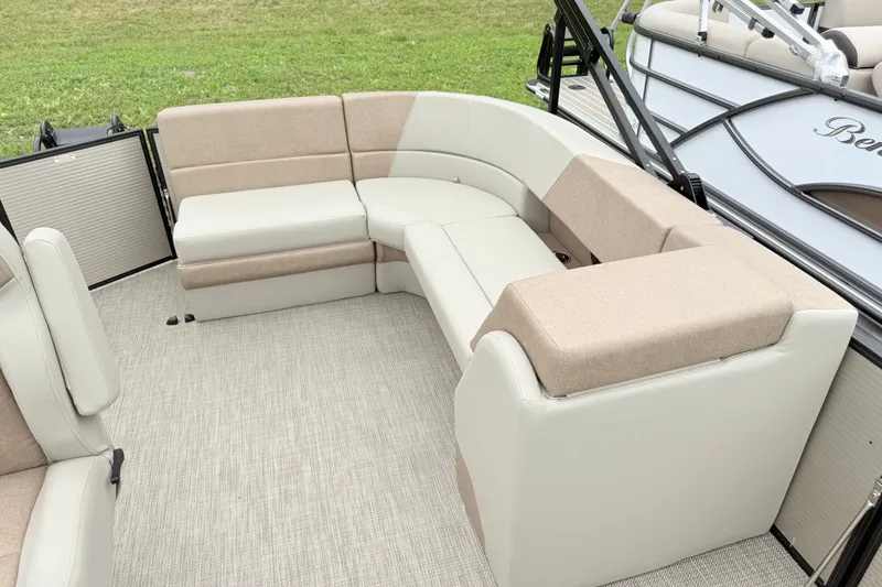 Slide: The Image of Luxurious seating on 2027 Manitou Aurora SE 21 pontoon boat, featuring beige and cream upholstery. - 7