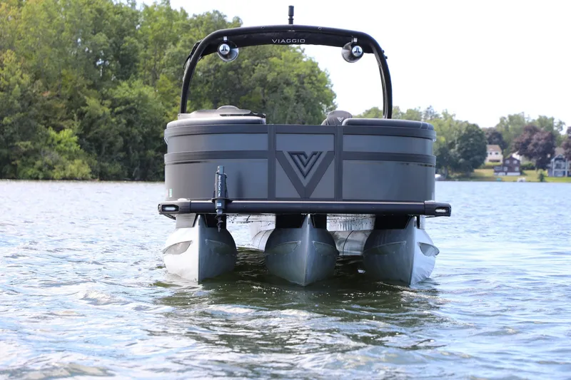 Slide: The Image of 2024 Viaggio D24U pontoon boat on a serene lake with lush greenery. - 3