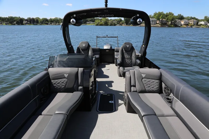 Slide: The Image of 2024 Viaggio D24U boat interior with luxurious seating on a serene lake. - 5