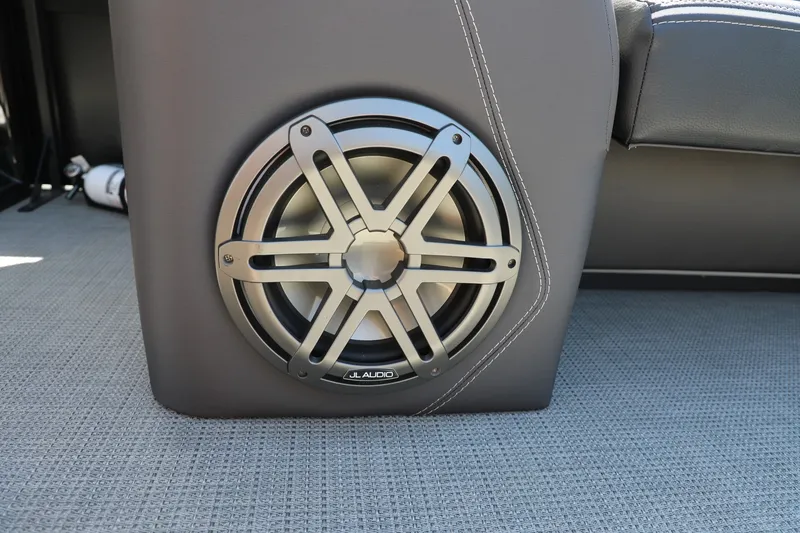 Slide: The Image of Speaker system in Viaggio D24U 2024 boat, featuring JL Audio subwoofer on gray upholstery. - 9