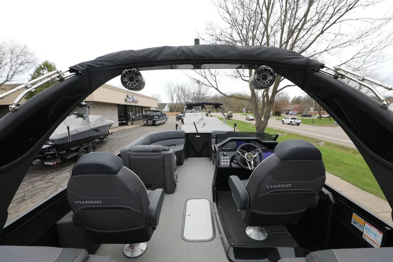 Slide: The Image of 2024 Viaggio D24U boat interior with sleek seating and modern dashboard design. - 8