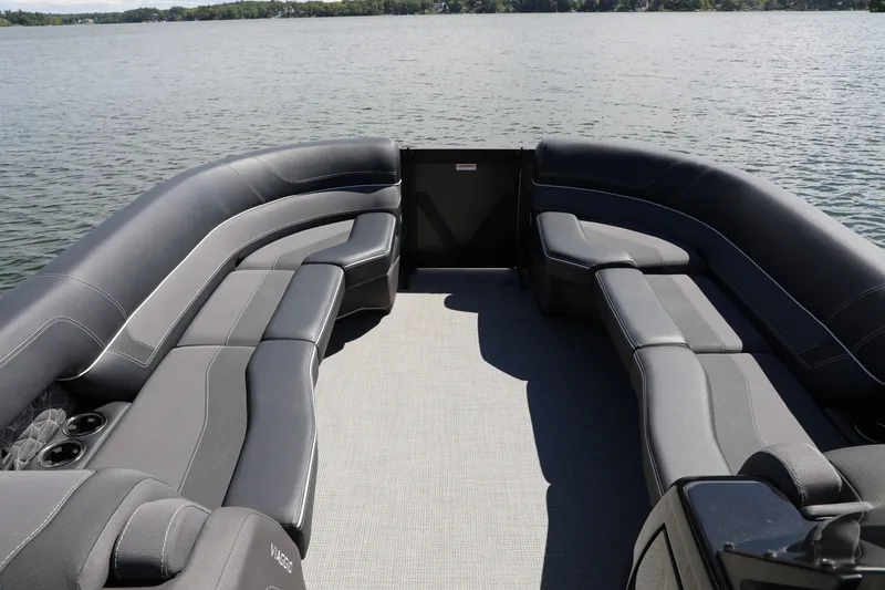 Slide: The Image of 2024 Viaggio D24U pontoon boat with spacious seating on a serene lake. - 2