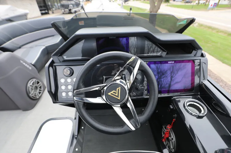 The Image of 2024 Viaggio D24U boat dashboard with steering wheel and modern controls. - 1
